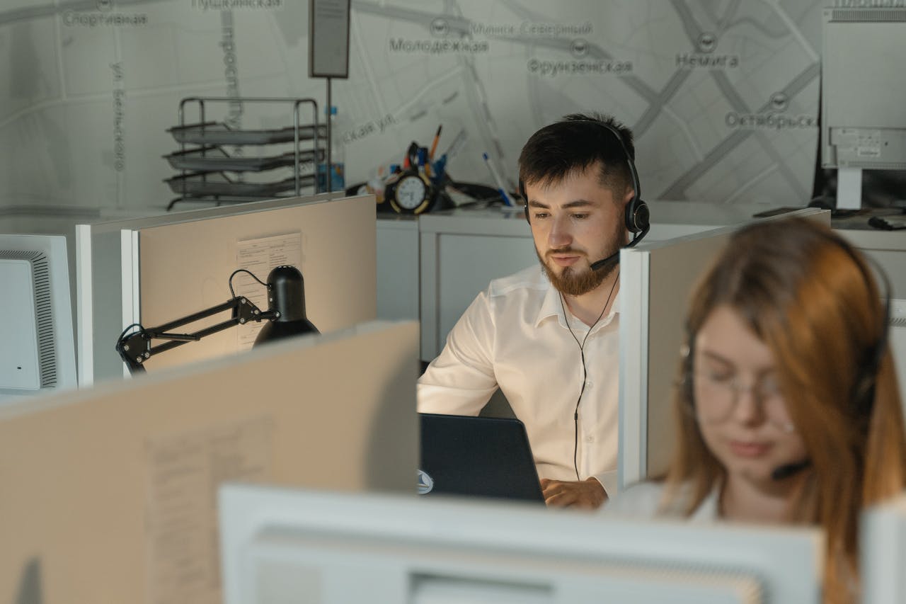 services-02 Dedicated call center agents working diligently at their desks in an office.